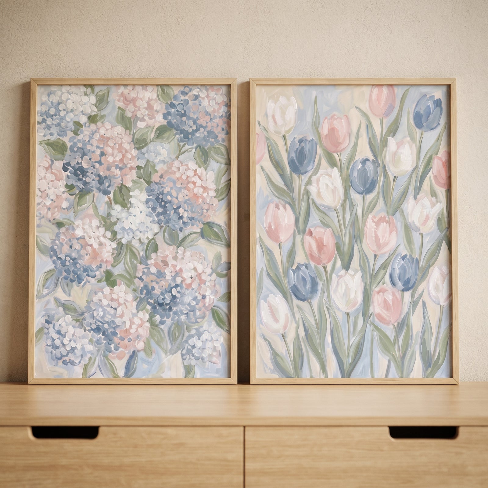 Soft blush spring bloom floral wall art set of 2 featuring blue and pink hydrangeas and tulips in light wood frames.