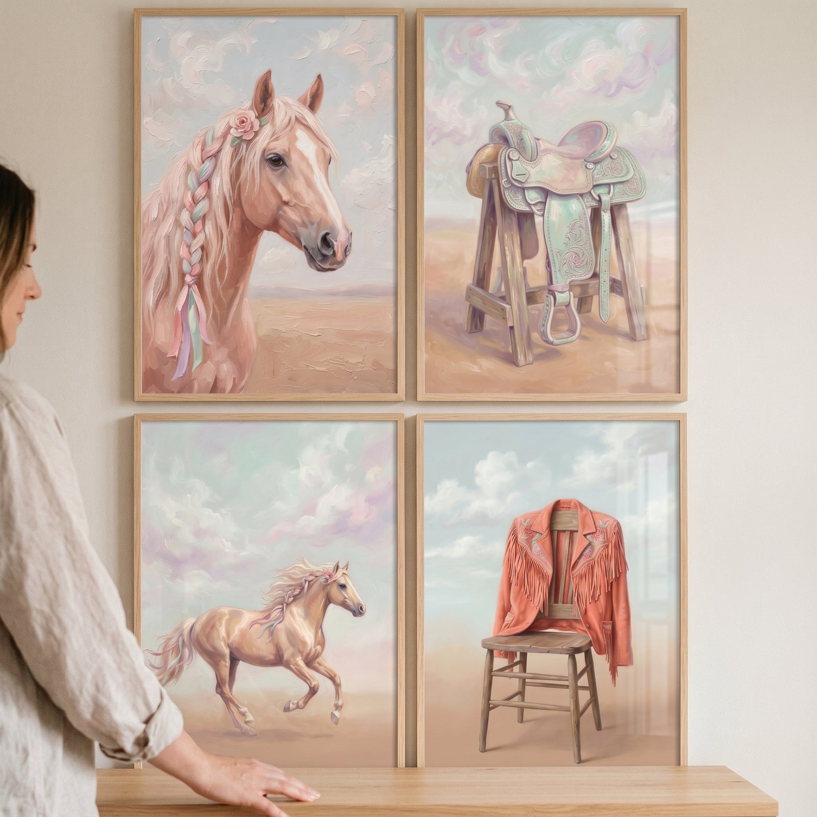 Soft blush western cowgirl wall art set of 4 featuring horses, a saddle, and a fringed jacket in pastel colors.