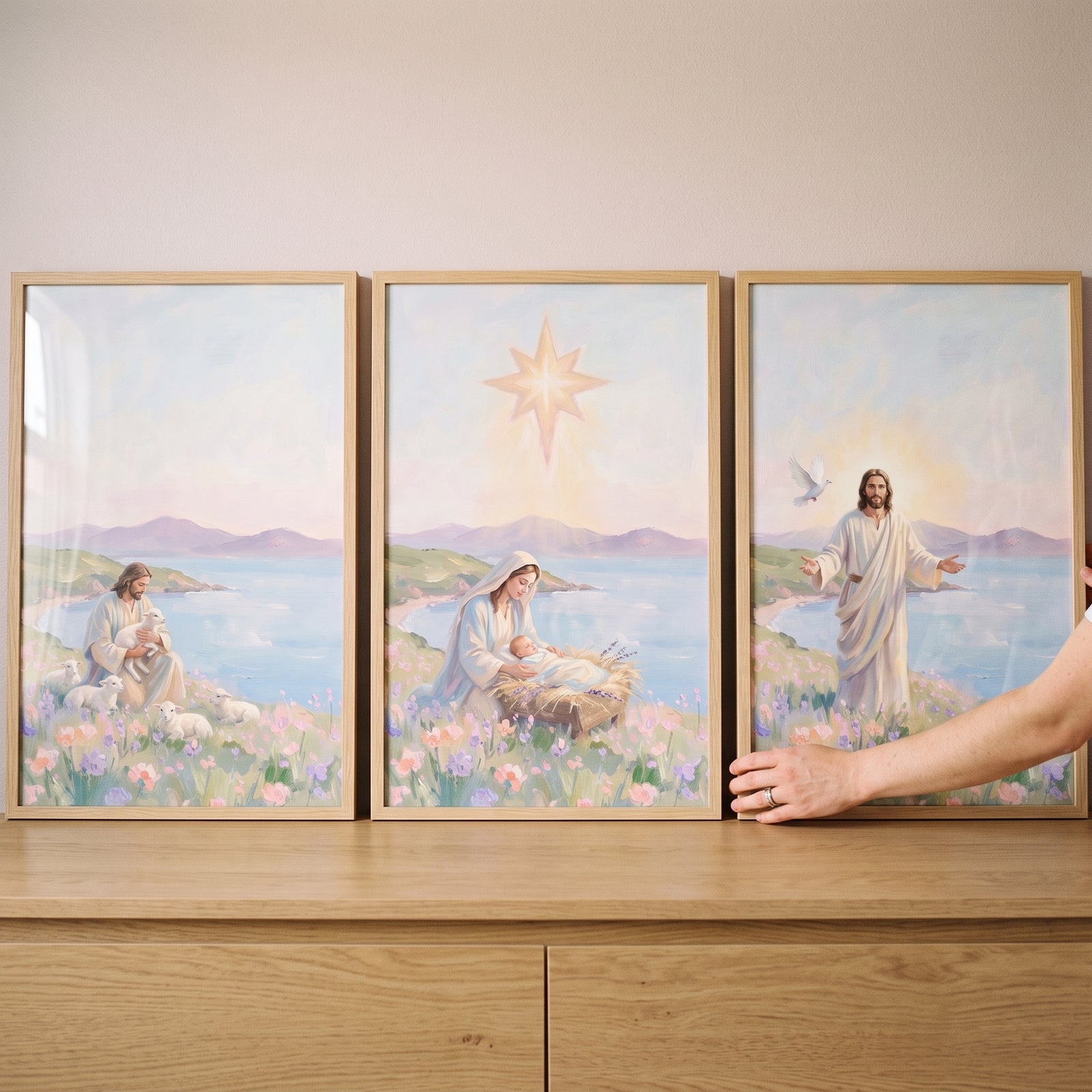 Soft coastal lilac jesus wall art set of 3 featuring Jesus with lambs, Mary with baby Jesus, and a dove by the sea.