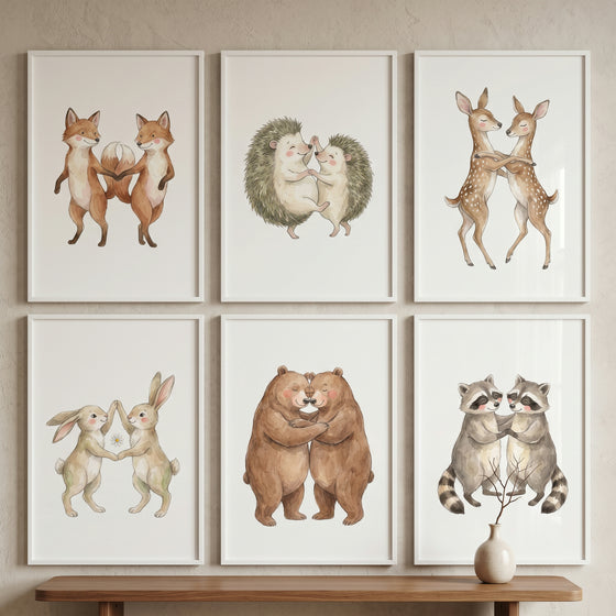 Pairs of foxes, hedgehogs, deer, rabbits, bears, and raccoons in a soft dancing animal wall art set of 6 above a bench.