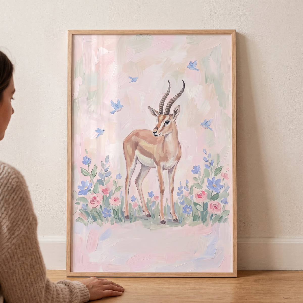 Soft floral pastel gazelle floral wall art features a graceful gazelle, blue birds, and flowers in a wooden frame.