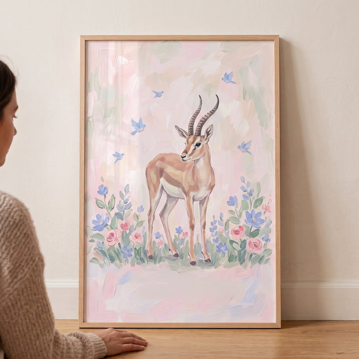 Soft floral pastel gazelle floral wall art features a graceful gazelle, blue birds, and flowers in a wooden frame.