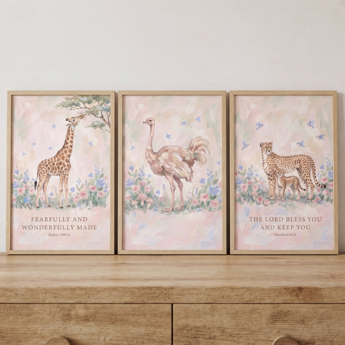 Soft floral savanna animals wall art set of 3 with a giraffe, ostrich, and cheetah family including scripture.