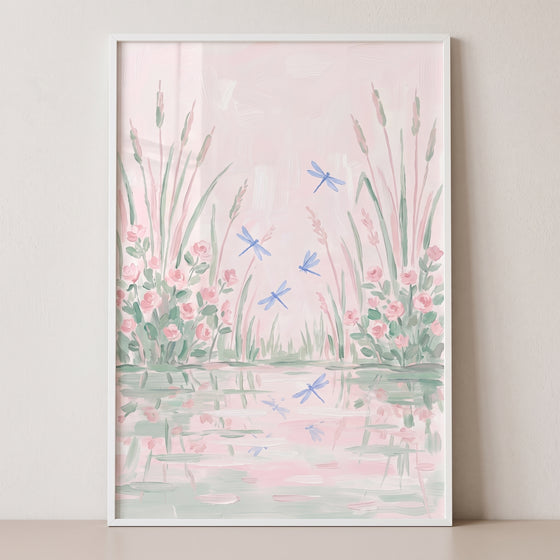 Soft flying blue dragonfly floral wall art shows pink blossoms and reeds reflected in a calm, pastel pink pond.