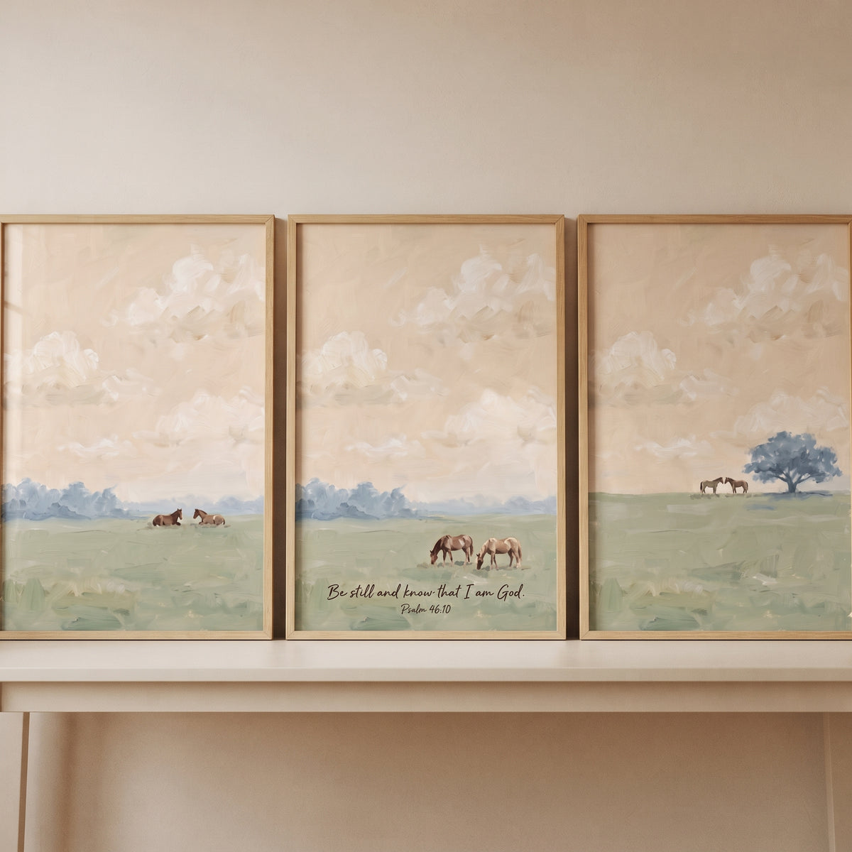 A soft glow meadow horse wall art set of 3 displays brown horses in a green field under a pale sky with a scripture verse.