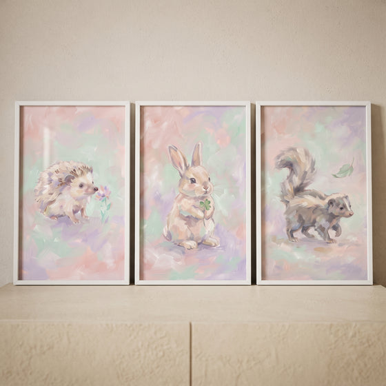 Soft lilac baby animal wall art set of 3 with pastel illustrations of a hedgehog, rabbit, and skunk.