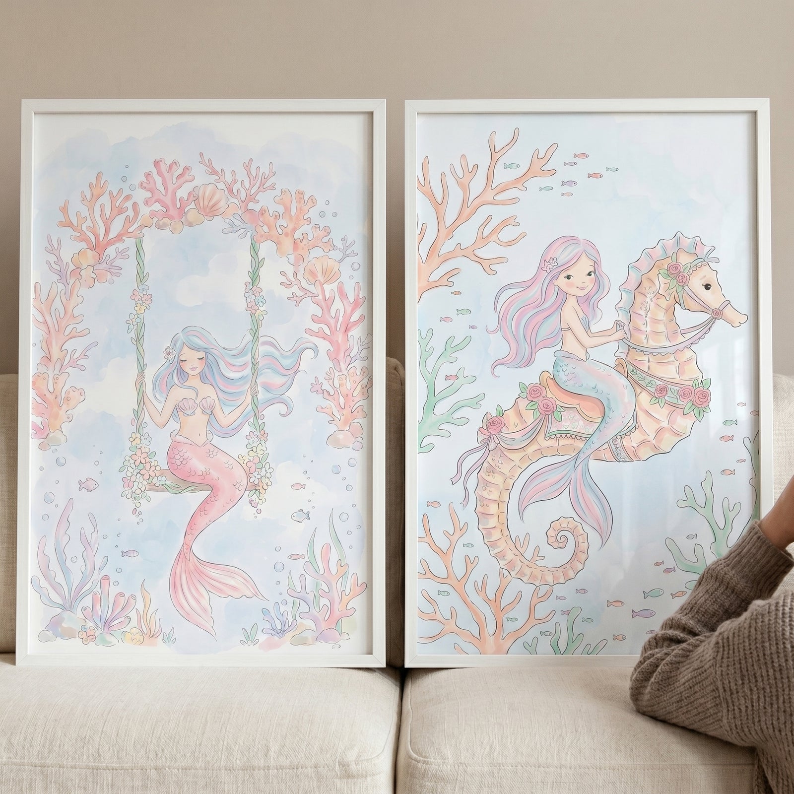 Two pastel illustrations of a mermaid on a swing and one on a seahorse as soft mermaid wall art set of 2.