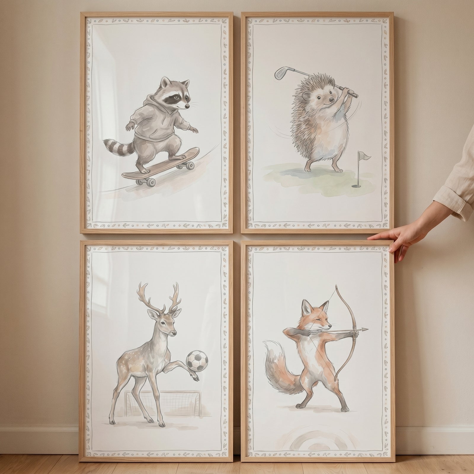 Soft muted athletic animals wall art set of 4 featuring a raccoon, hedgehog, deer, and fox playing various sports.