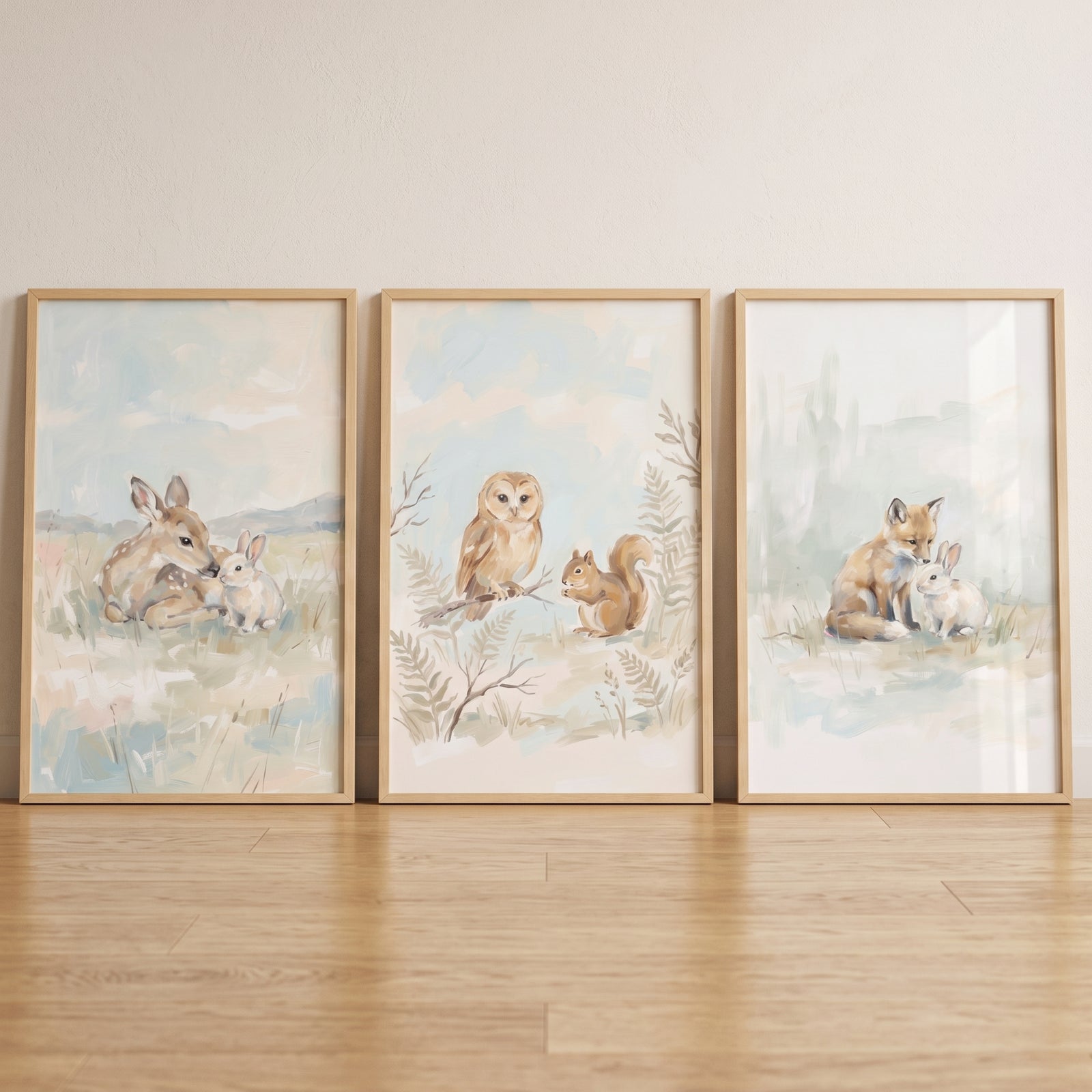 Soft muted woodland animals wall art set of 3 includes framed deer, owl, squirrel, fox, and rabbit illustrations.