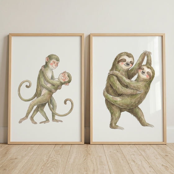 Soft neutral dancing animal wall art set of 2 with framed illustrations of dancing monkeys and sloths.