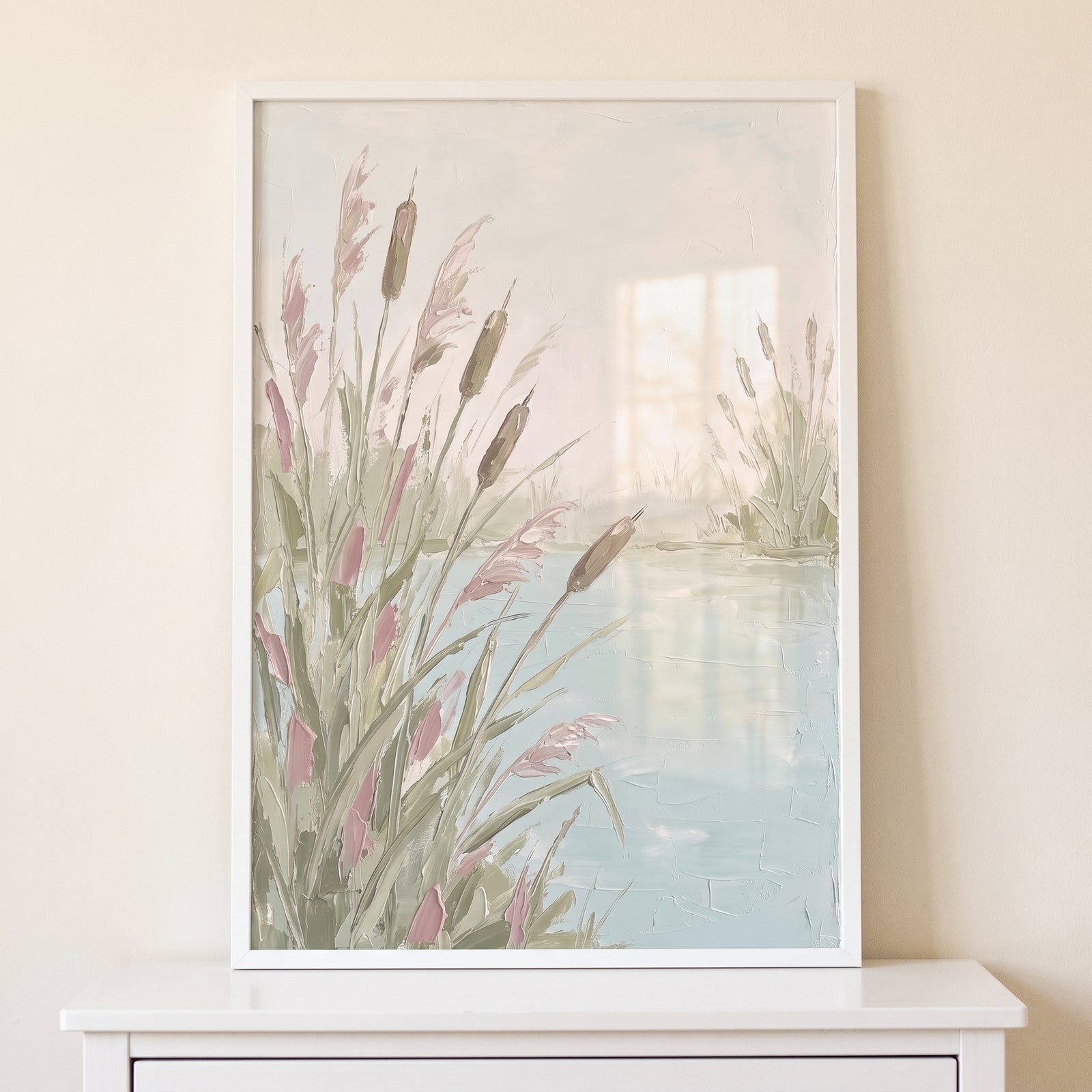 Framed soft pastel cattail pond wall art features textured green and pink reeds by a tranquil light blue pond.