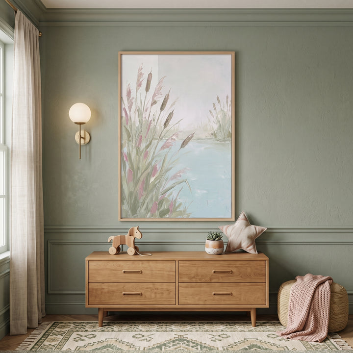 Soft pastel cattail pond wall art above a wooden dresser in a sage green room with a star pillow and toy horse.