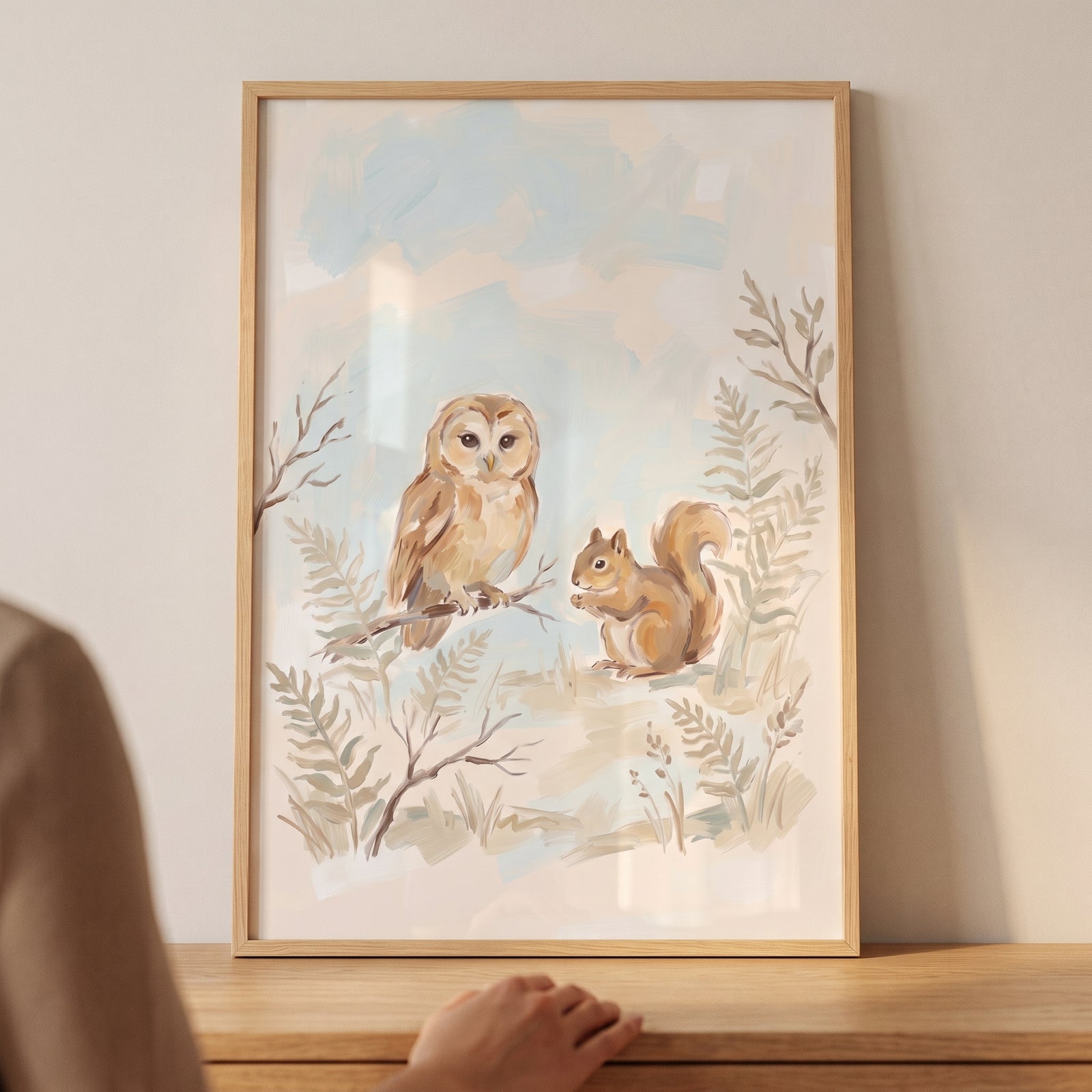 Soft pastel owl squirrel animals wall art depicts an owl perched on a branch beside a squirrel in a woodland scene.