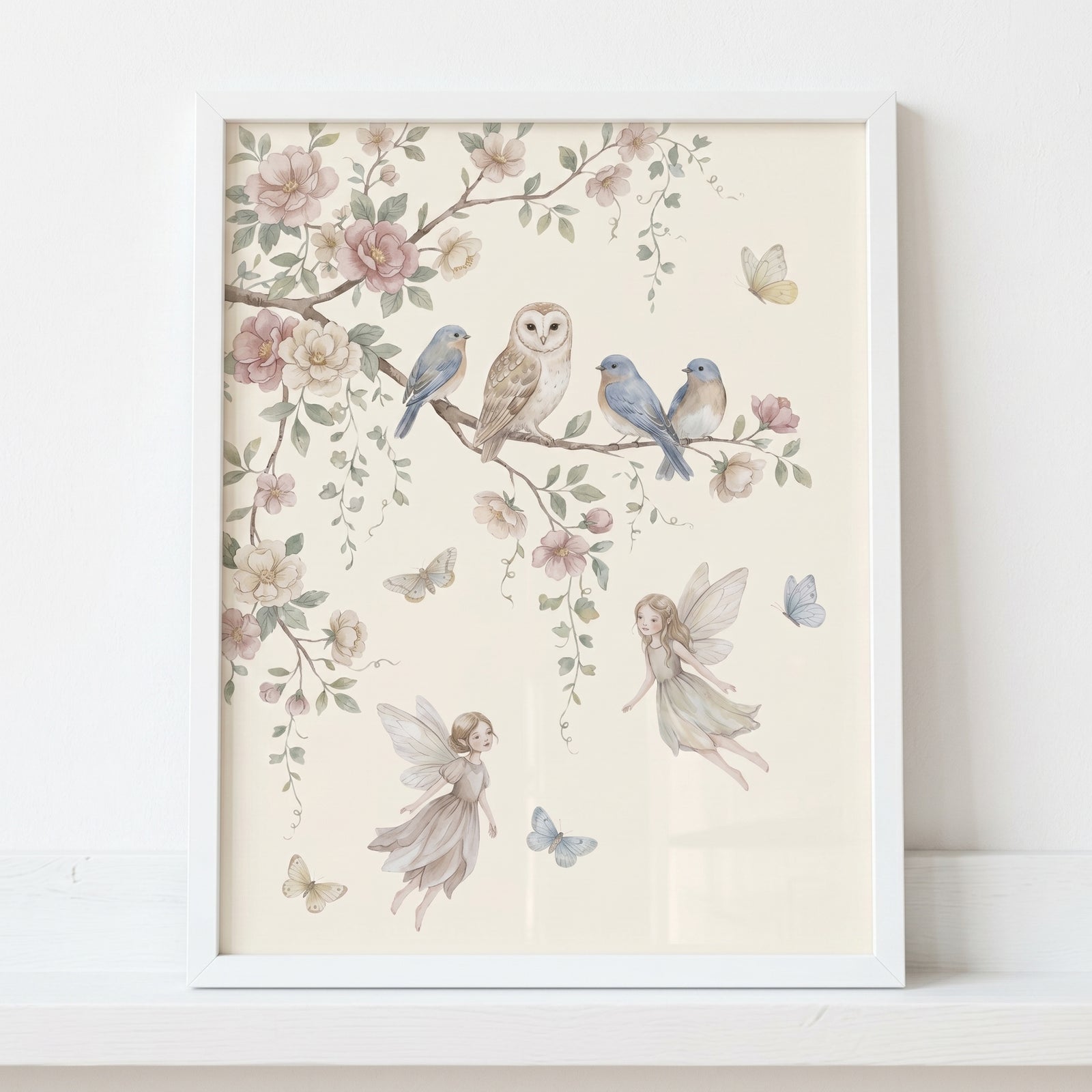 Soft pastel perched bluebird wall art featuring an owl, fairies, and butterflies on floral branches in a white frame.