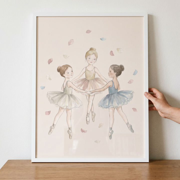 Three young girls in tutus dance in a circle surrounded by petals in this soft pastel petal ballerina wall art.