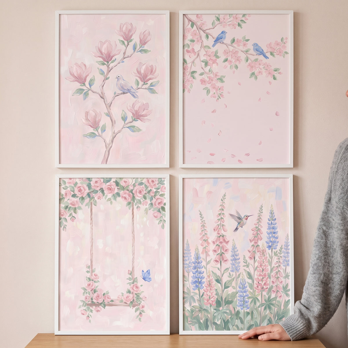 Soft pastel pink garden wall art set of 4 showing birds, magnolias, cherry blossoms, a floral swing, and lupine flowers.
