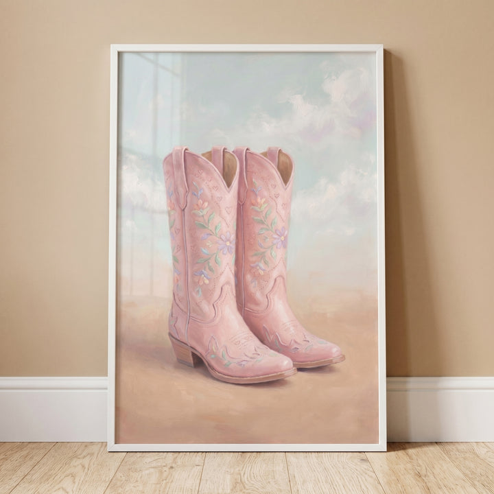 Framed soft pink floral boots wall art featuring embroidered western footwear against a cloudy sky and sandy ground.