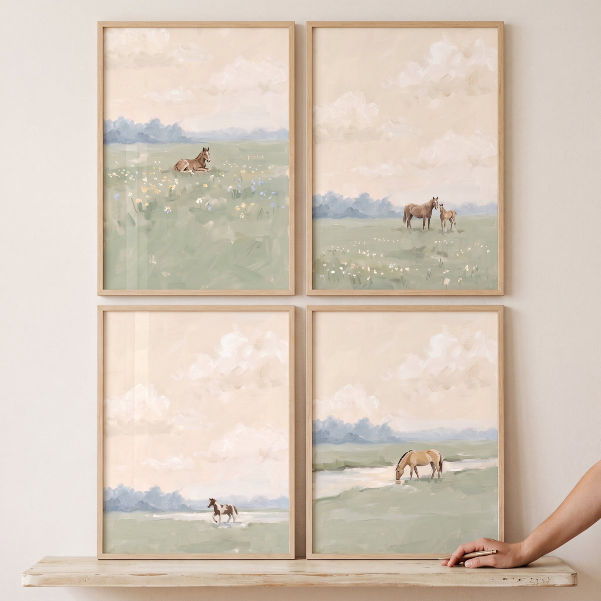 Soft sage meadow horses wall art set of 4 featuring horses in muted green fields under a pale cloudy sky.