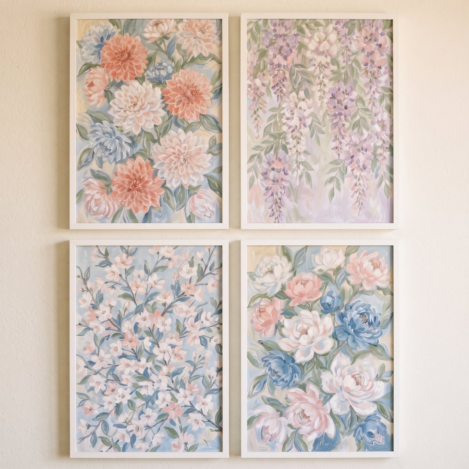 Soft sage pastel floral wall art set of 4 featuring wisteria and peony designs in thin white frames on a neutral wall.