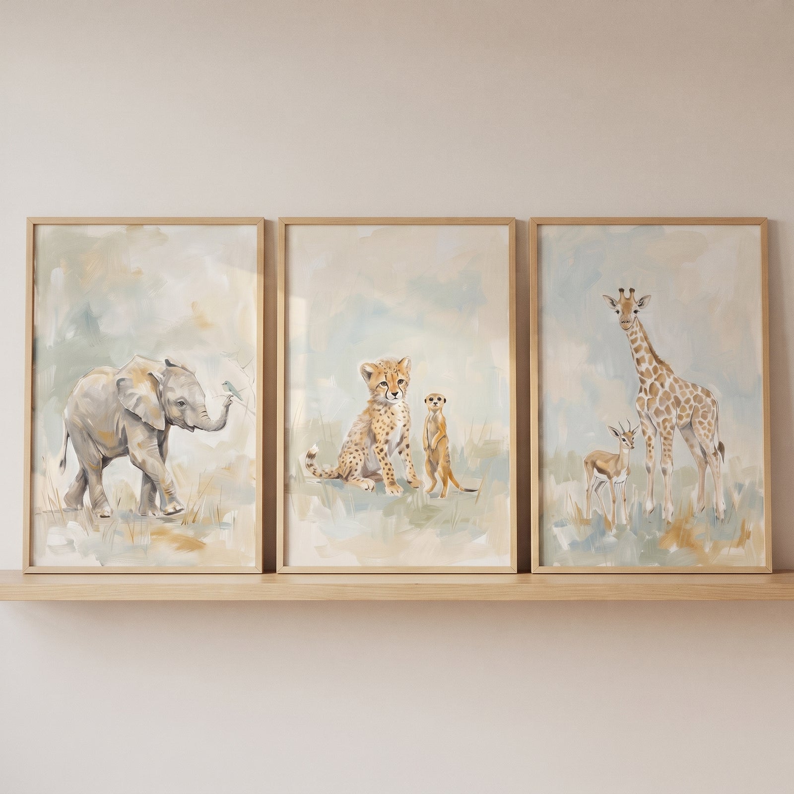 Soft sage savanna animals wall art set of 3 featuring an elephant, cheetah, meerkat, giraffe, and antelope on a shelf.