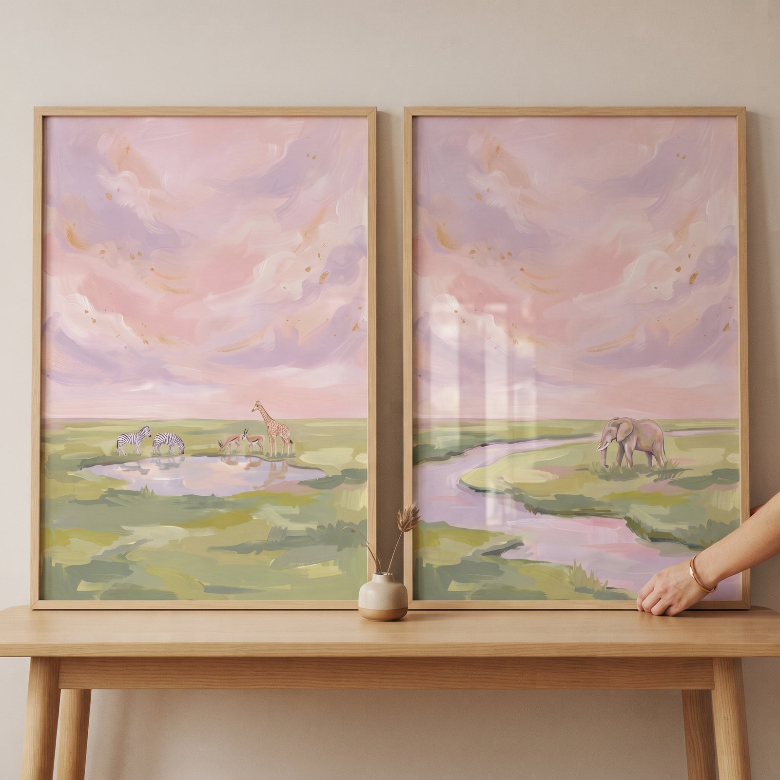 Soft textured safari animals wall art set of 2 shows an elephant and giraffe in a pastel pink savanna landscape.
