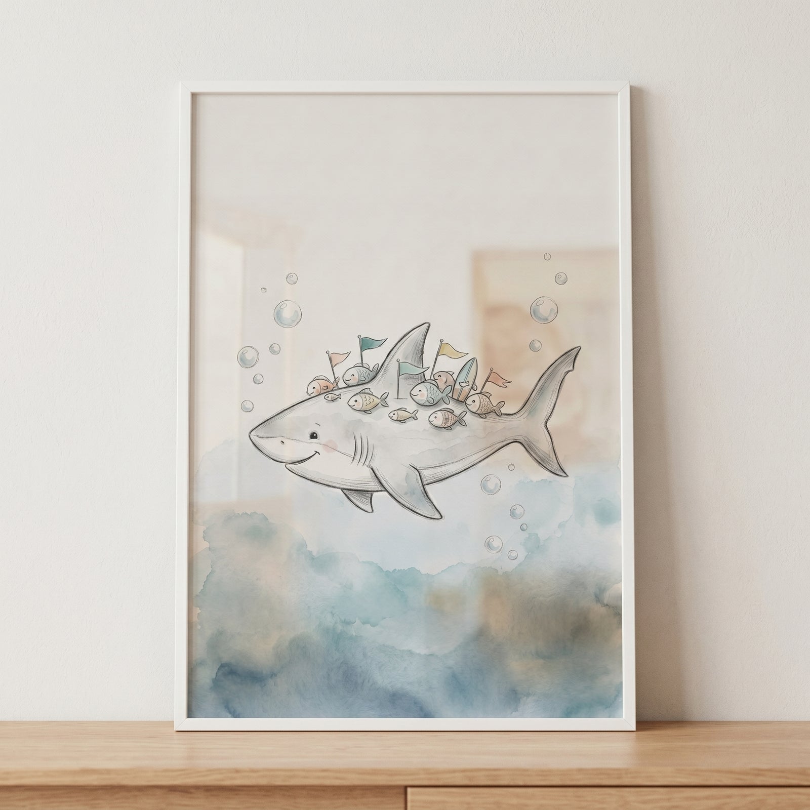 Framed soft watercolor friendly shark wall art with a smiling shark carrying small fish and colorful flags.