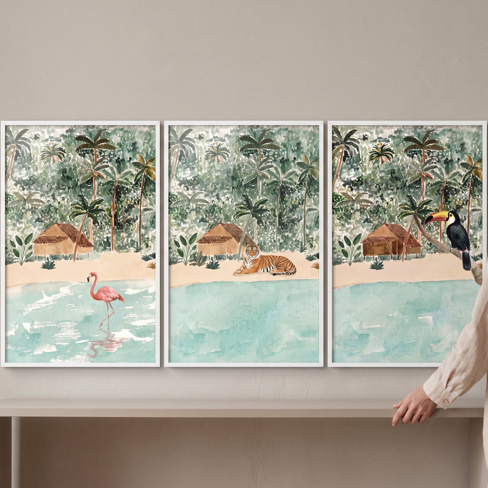 Soft watercolor island landscape animals wall art set of 3 with a flamingo, tiger, and toucan on a tropical beach.