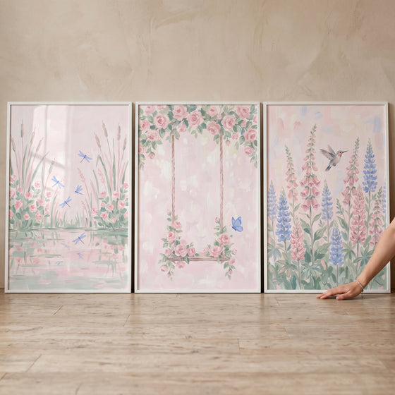 Soft watercolor pink meadow wall art set of 3 featuring a pond with dragonflies, a rose swing, and a hummingbird.
