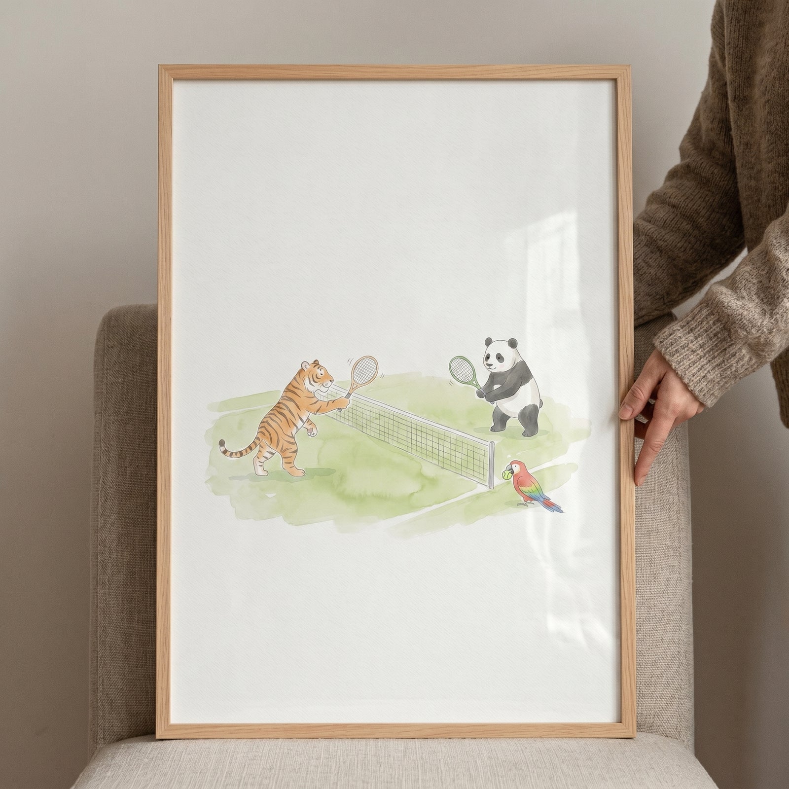 Tiger and panda play tennis near a parrot in this soft watercolor tennis animals wall art within a wooden frame.