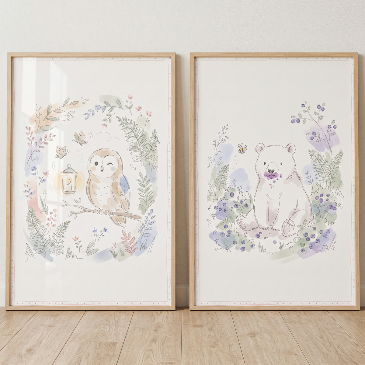 Soft watercolor woodland animal wall art set of 2 features a winking owl and a bear with purple berries in a light wood.