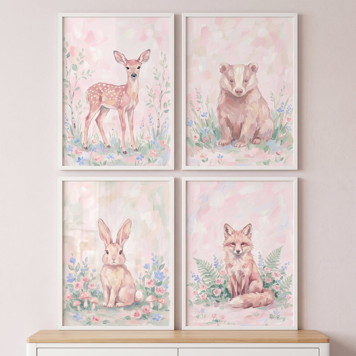 Soft wildflower woodland animals print set of 4 featuring a fawn, badger, rabbit, and fox in pastel floral settings.