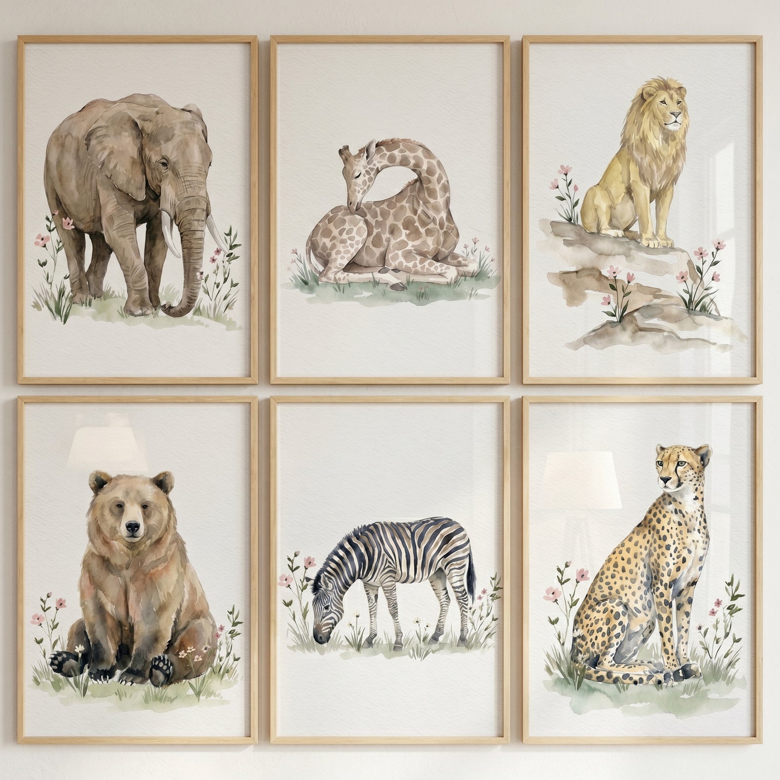 Soft wildlife animal wall art set of 6. Framed elephant, giraffe, lion, bear, zebra, and cheetah watercolor illustrations.
