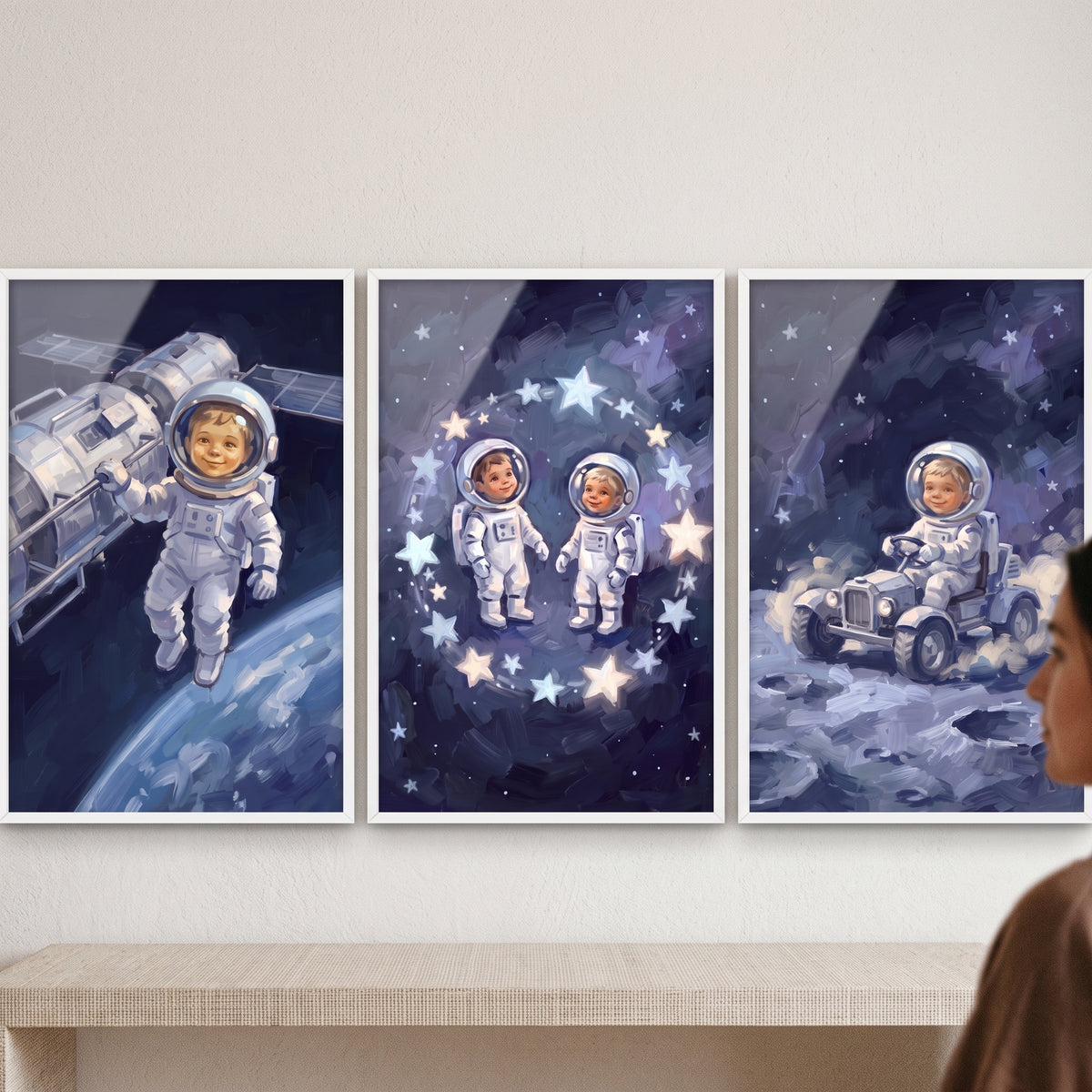 Sophisticated cosmic baby astronaut wall art set of 3 featuring cute toddlers in space suits exploring the moon and stars.