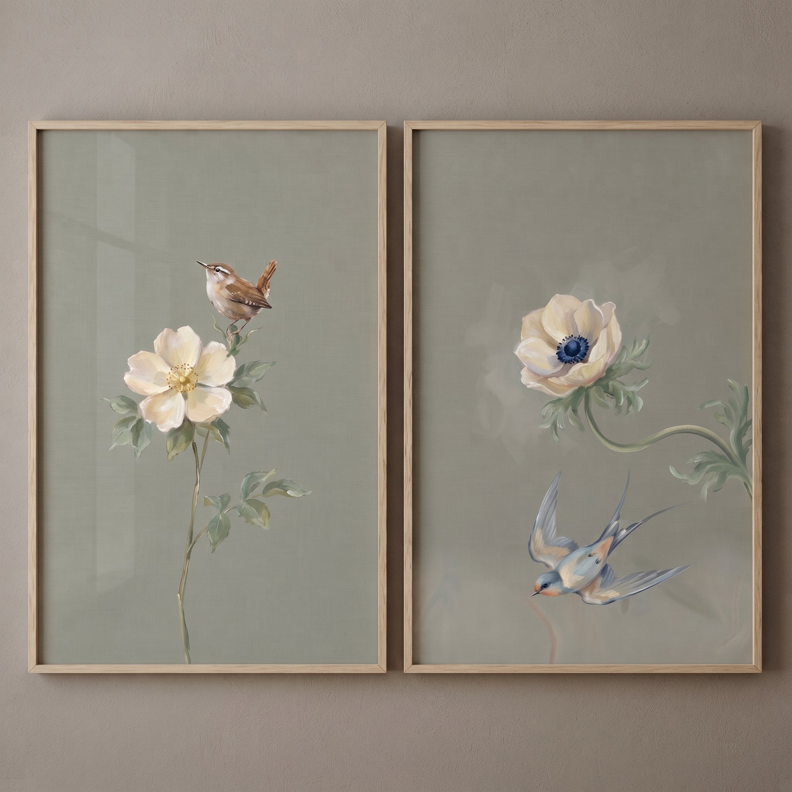Sophisticated cream floral bird wall art set of 2 with birds and cream flowers on sage green backgrounds in wood frames.