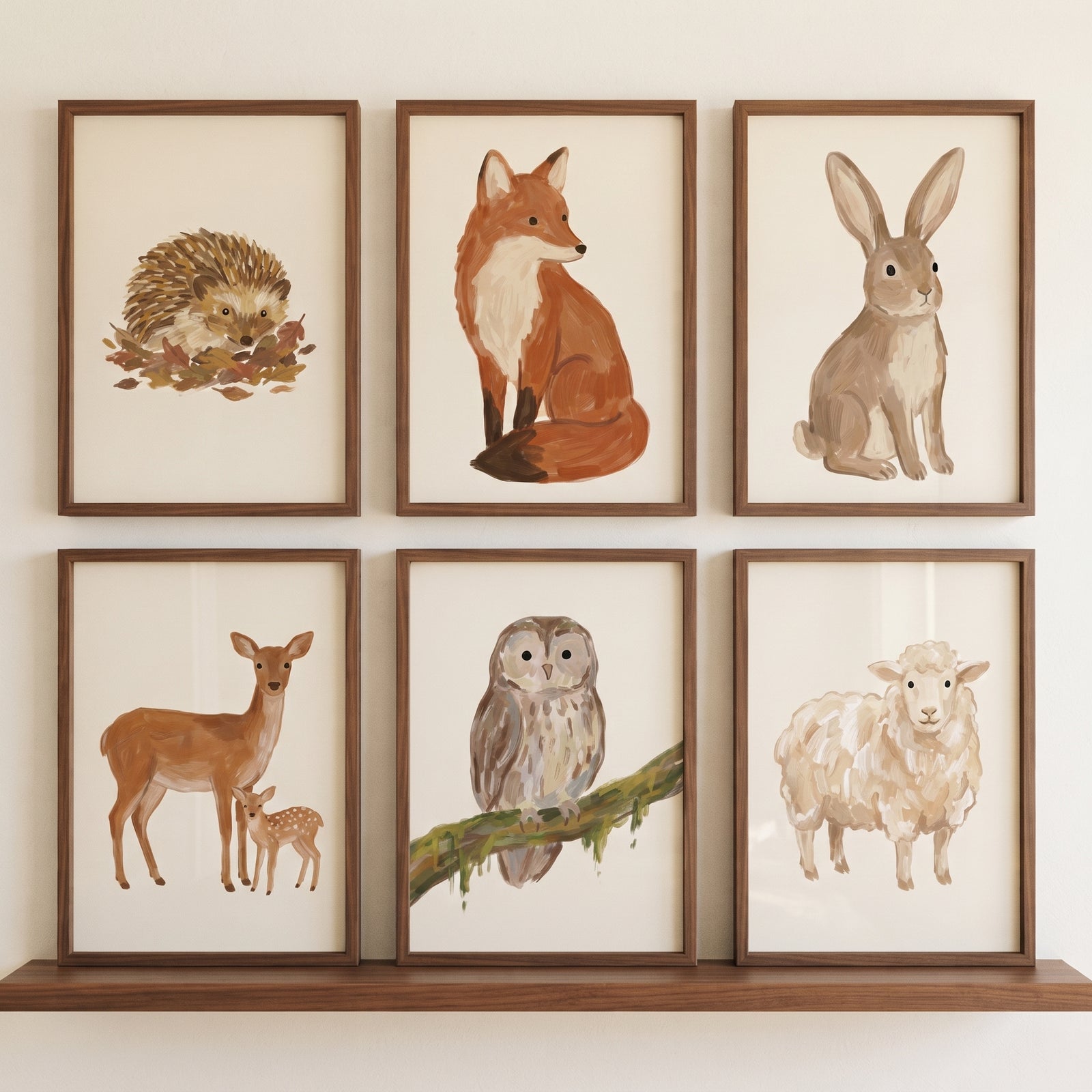 Sophisticated earthy woodland animals wall art set of 6 featuring a hedgehog, fox, rabbit, deer, owl, and sheep.