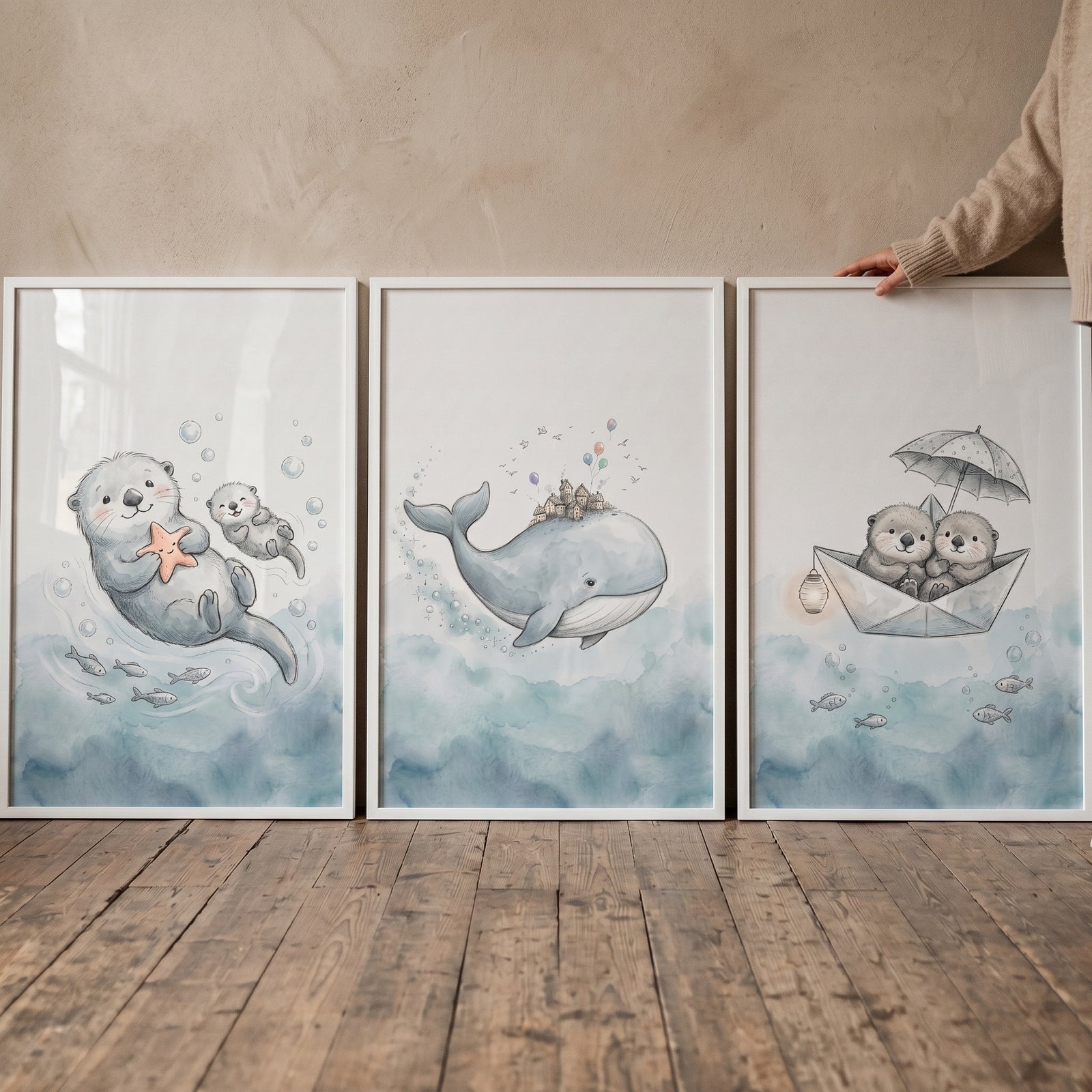 Sophisticated indigo ocean animal wall art set of 3 featuring whimsical white framed watercolor otters and a whale.