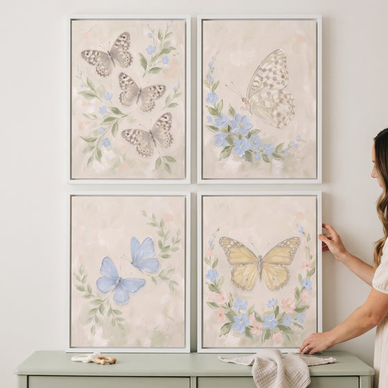 Sophisticated neutral garden butterfly wall art set of 4 in white frames hanging on a wall above a green dresser.