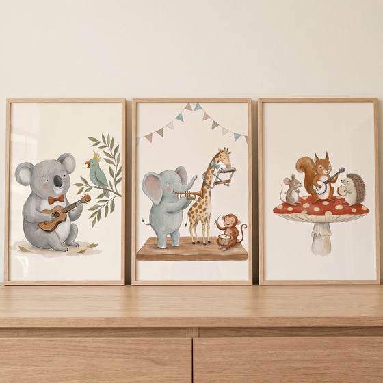 Sophisticated neutral musical animal wall art set of 3 featuring a koala, elephant, and squirrel playing instruments.