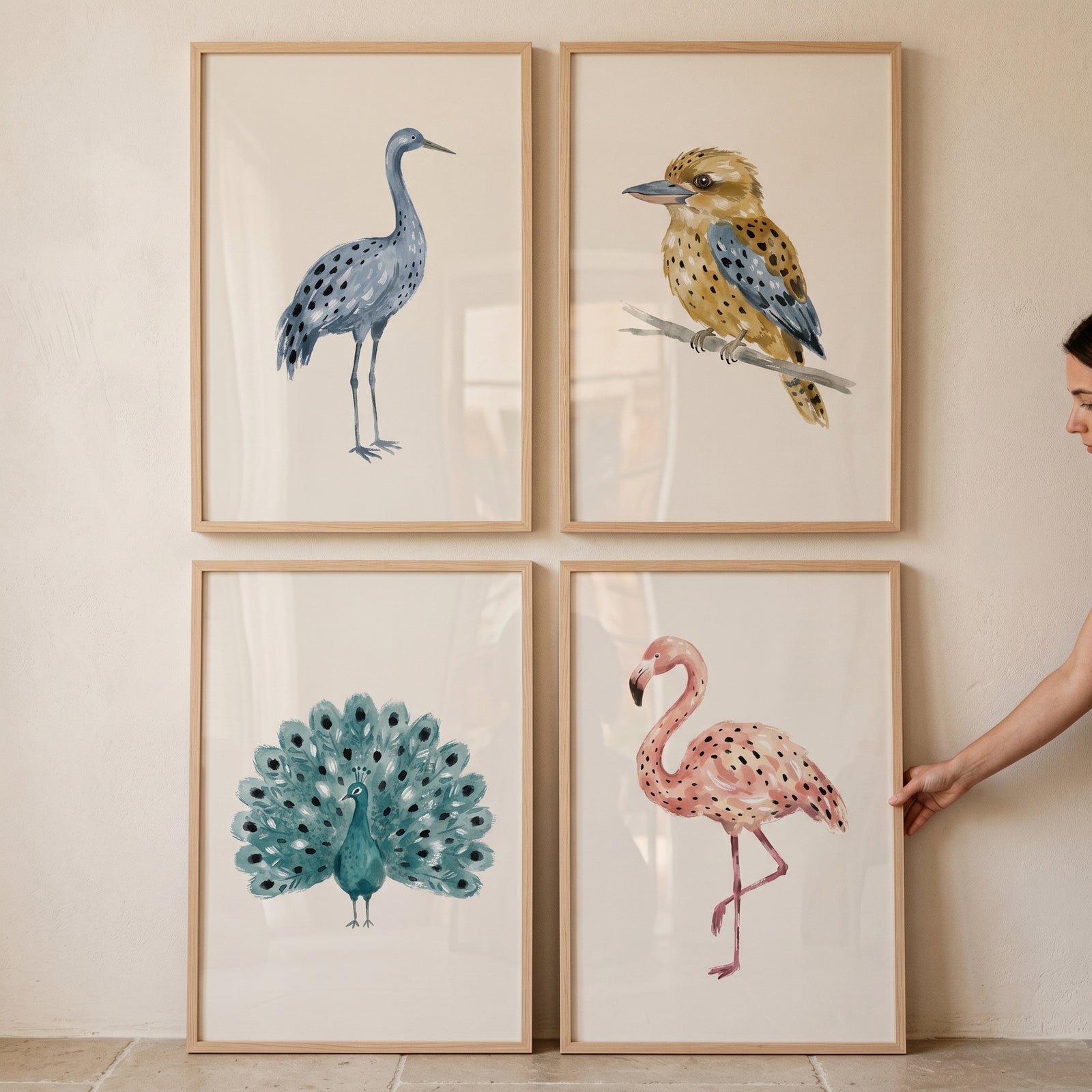 Sophisticated neutral watercolor birds wall art set of 4 featuring a blue crane, kookaburra, peacock, and pink flamingo.