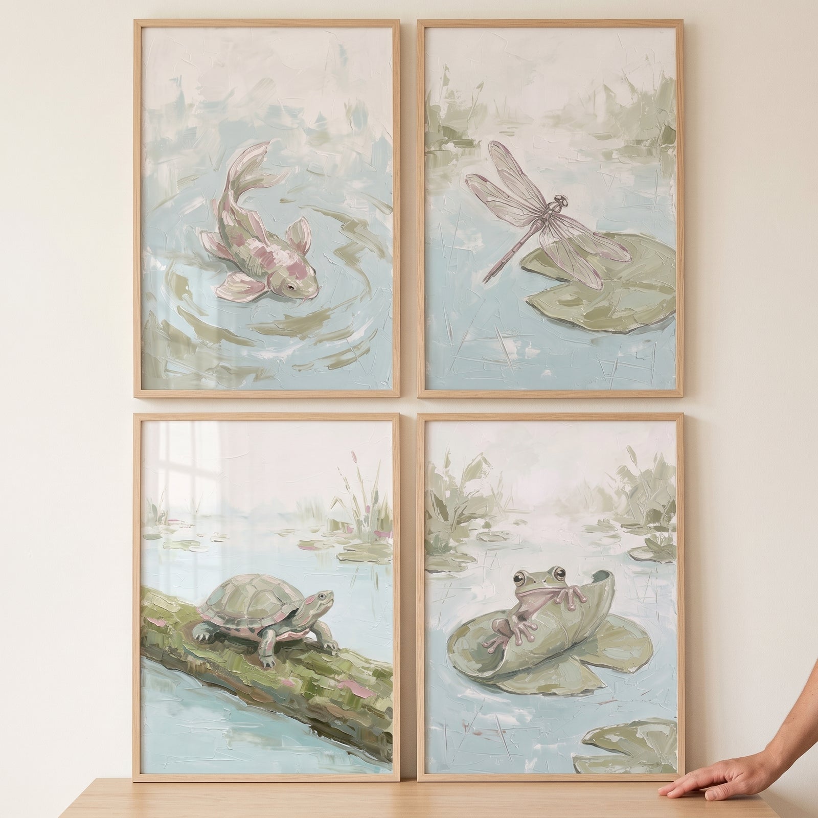 Sophisticated sage pond animals wall art set of 4 features a fish, dragonfly, turtle, and frog in light wood frames.