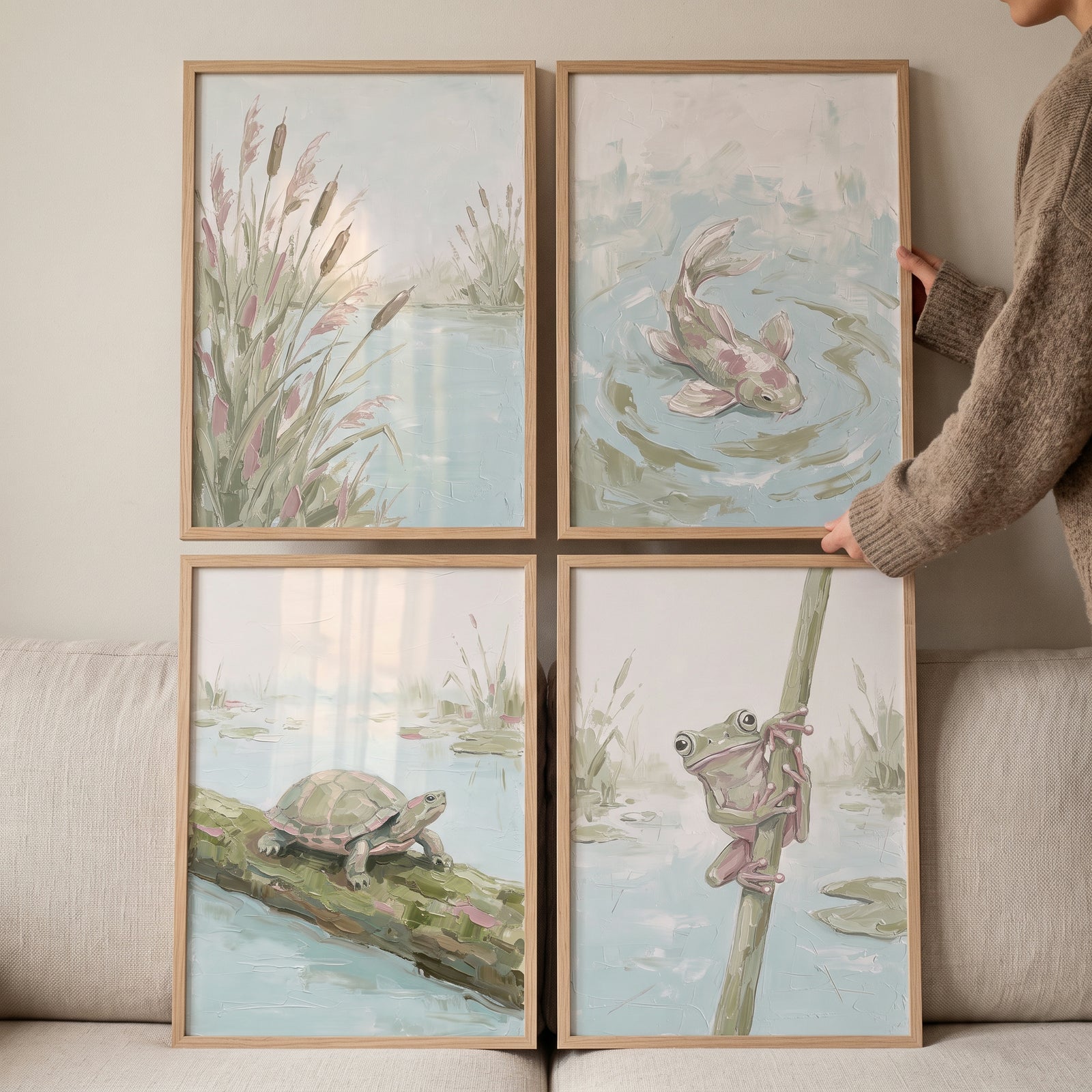 Sophisticated sage pond animals wall art set of 4 with a fish, turtle, frog, and reeds in muted green and blue tones.
