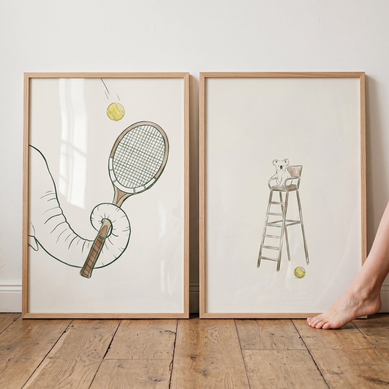 Sophisticated tennis animal wall art set of 2 shows an elephant trunk holding a racket and a koala on an umpire chair.