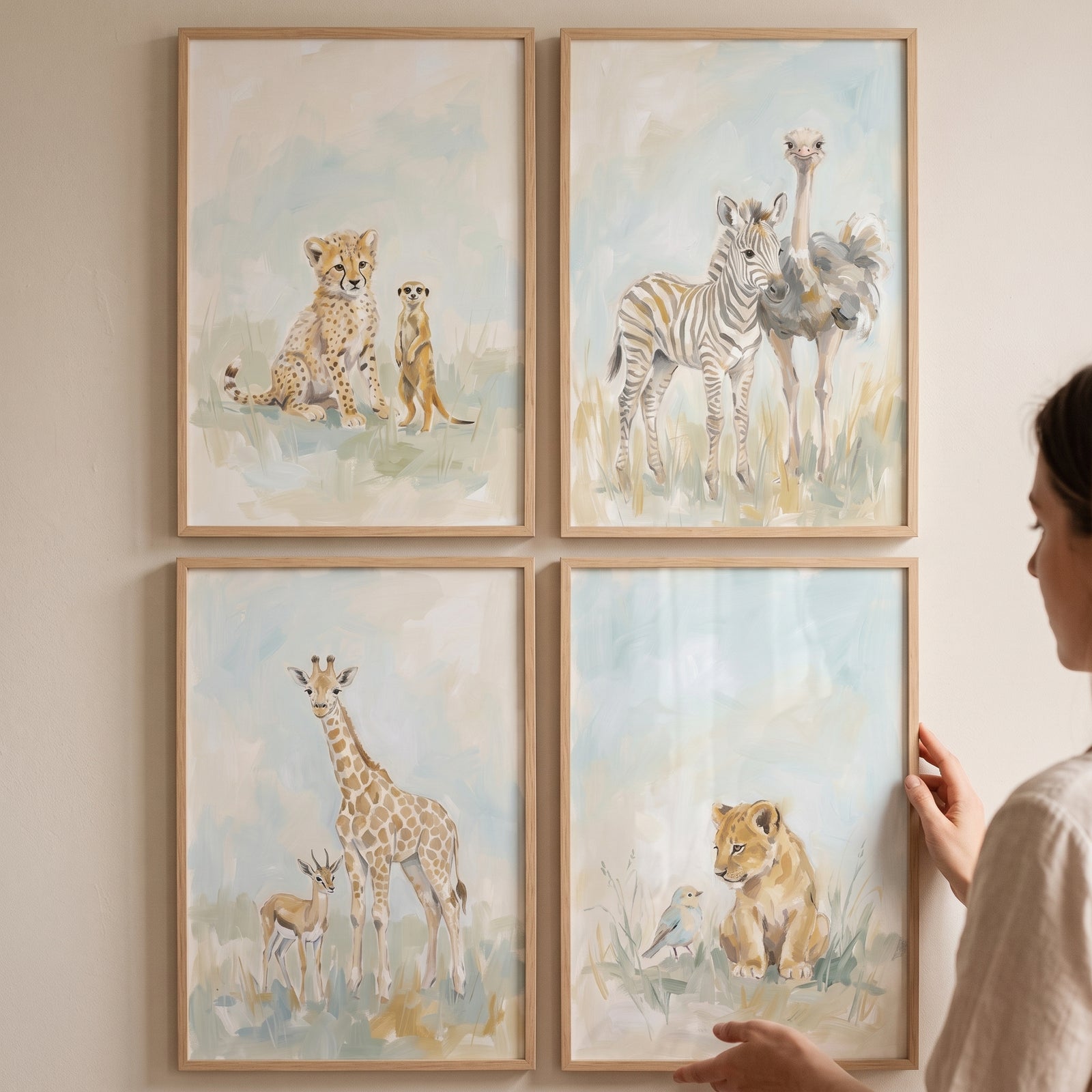 Sophisticated watercolor savanna animals wall art set of 4 featuring various wild animal pairs on a neutral wall.