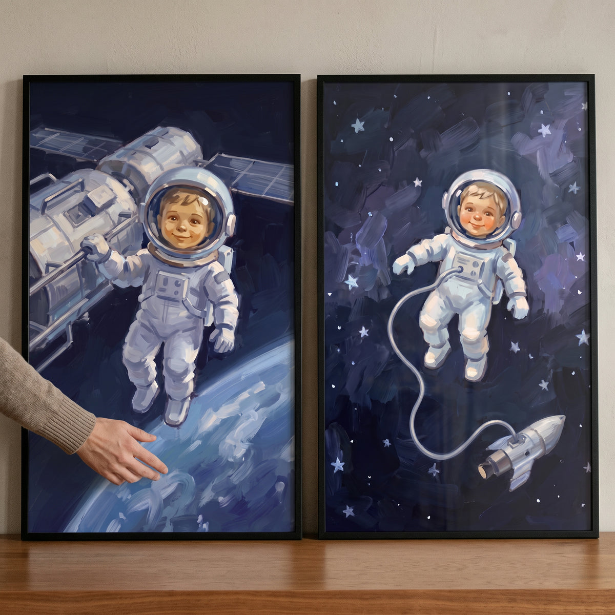 Space explorer baby astronaut wall art set of 2 showing smiling infants in spacesuits near a satellite and spaceship.