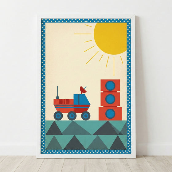 A framed graphic illustration featuring a stylized, minimalist space scene. A red and blue rover sits on a geometric terrain made of teal and dark green triangles. To the right, three red blocks with blue circular windows are stacked. A large yellow sun with thin rays is positioned in the upper right corner against a cream-colored background. The entire image is enclosed in a blue border with white polka dots and set within a simple white frame.