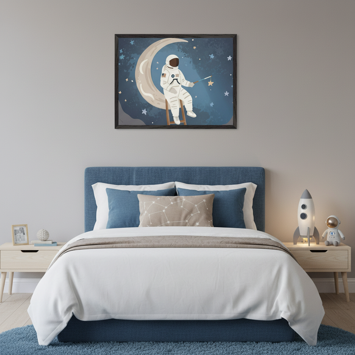 Kid's bedroom with a blue bed and wooden nightstands. A framed illustration of an astronaut sitting on a crescent moon, reaching for a star in a starry blue sky, hangs centered above the bed.