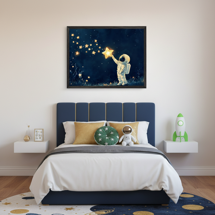 Kid's bedroom with a blue upholstered bed and two white floating nightstands. A framed whimsical painting of a small astronaut reaching for a glowing star in a dark night sky hangs centered above the bed.