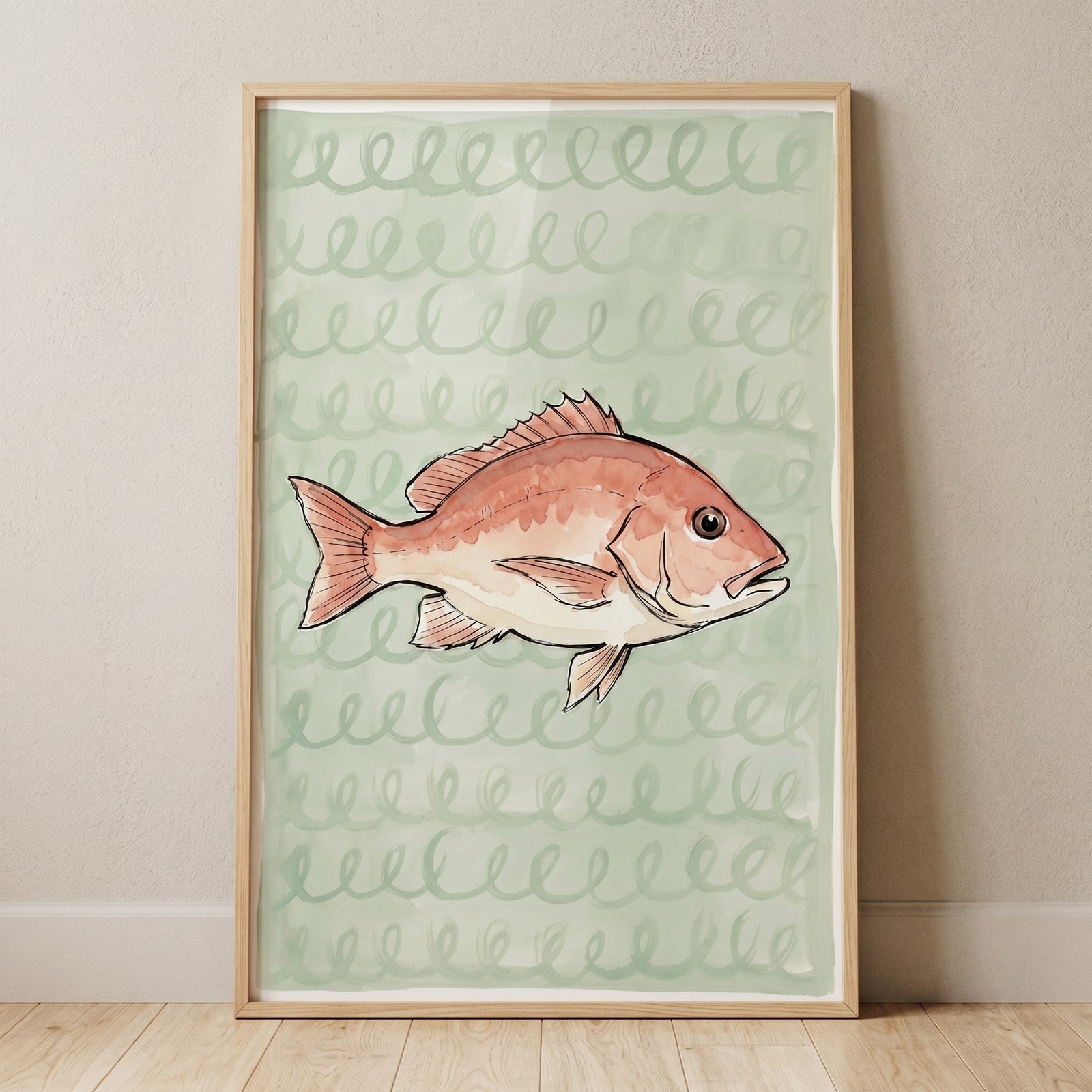 Spiral pattern sea bream fish wall art features a reddish fish on a green background in a wood frame leaning against a wall.