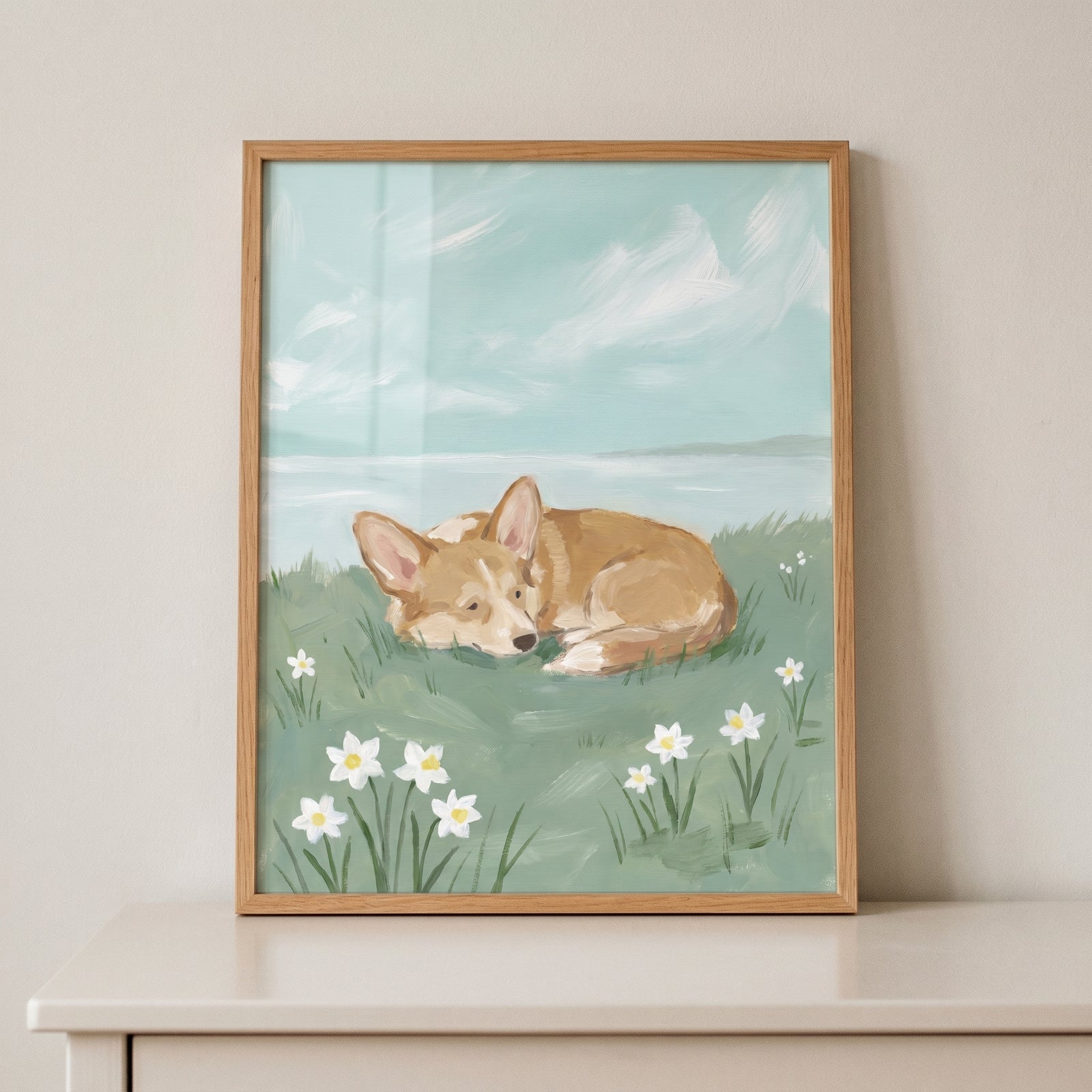 Spring meadow sleeping corgi dog artwork featuring a tan dog resting in grass with white flowers under a blue sky.