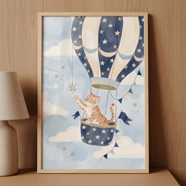 Star reaching watercolor tiger wall art with a tiger cub in a blue hot air balloon basket reaching for a star.